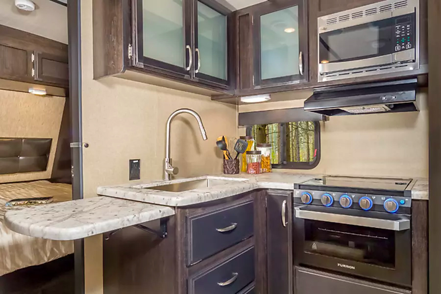 Kitchen inside "Texas Star", one of our premium travel trailers for rent.